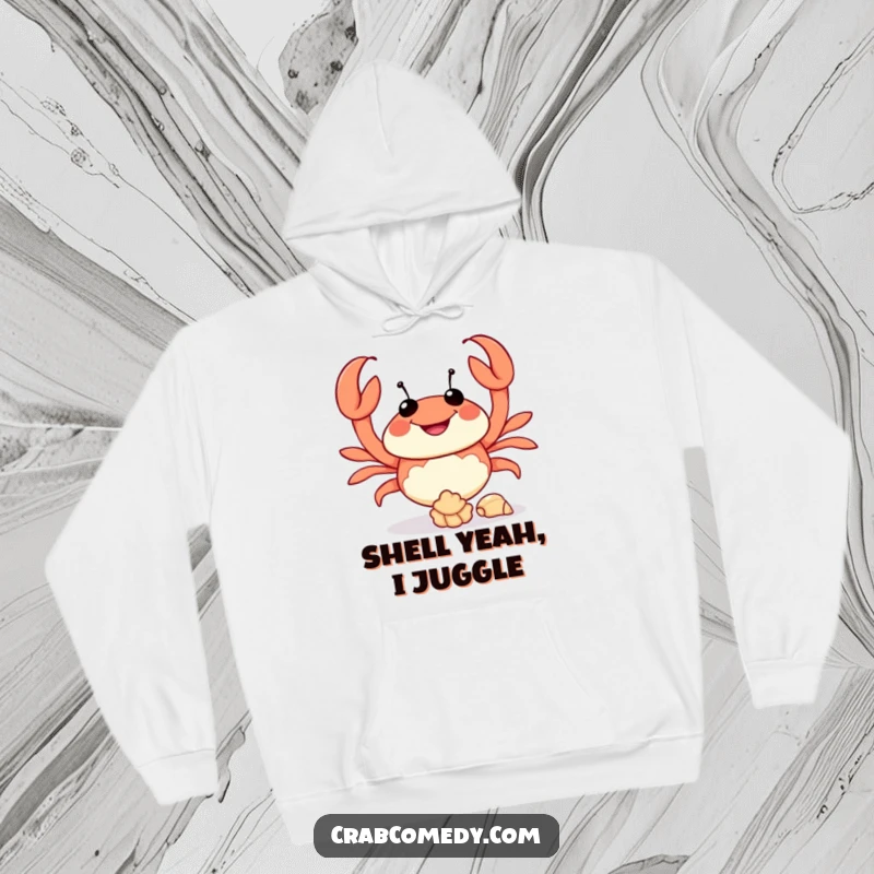 Funny hooded sweatshirt featuring a crab enthusiastically juggling seashells, perfect cozy gift.